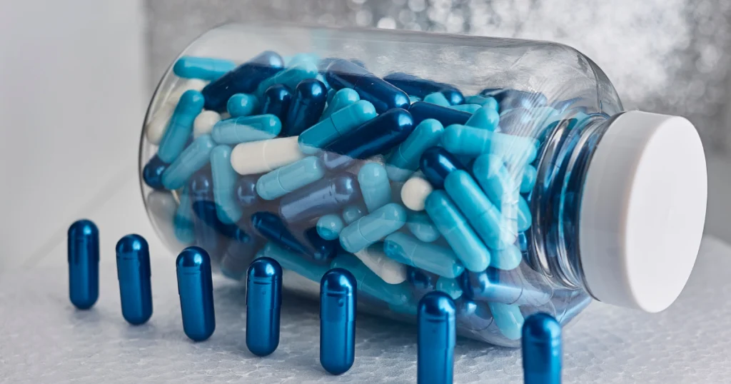 Jar of blue and white nutraceuticals capsules for treatment in Idaho Falls, ID